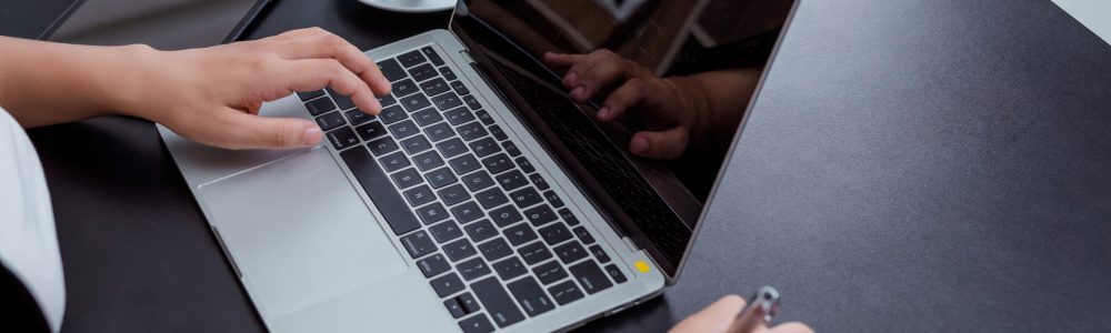 Businesswoman working in the office with a smile while sitting.